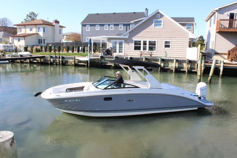 Slide: The Image of 2020 Sea Ray SDX 270 OB boat docked in a residential canal. - 4
