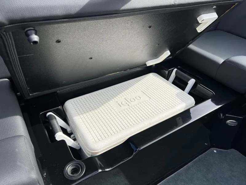 Slide: The Image of 2020 MasterCraft NXT22 boat storage compartment with Igloo cooler inside. - 12