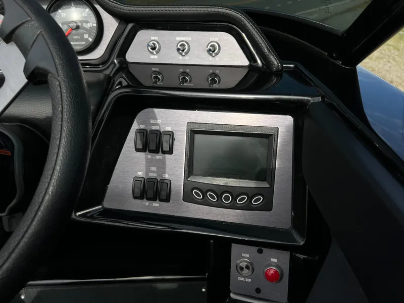 Slide: The Image of Dashboard of 2020 MasterCraft NXT22 boat with control panel and display screen. - 15