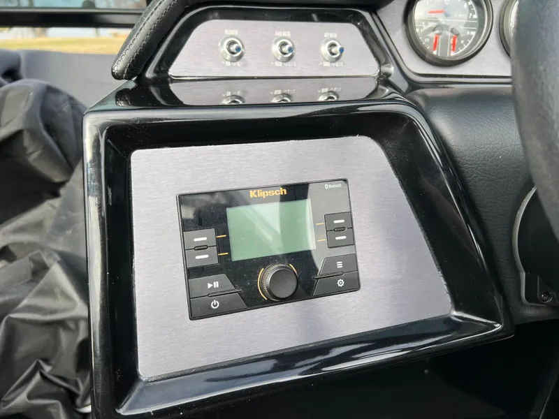 Slide: The Image of Dashboard of 2020 MasterCraft NXT22 with Klipsch audio system and control panel. - 16