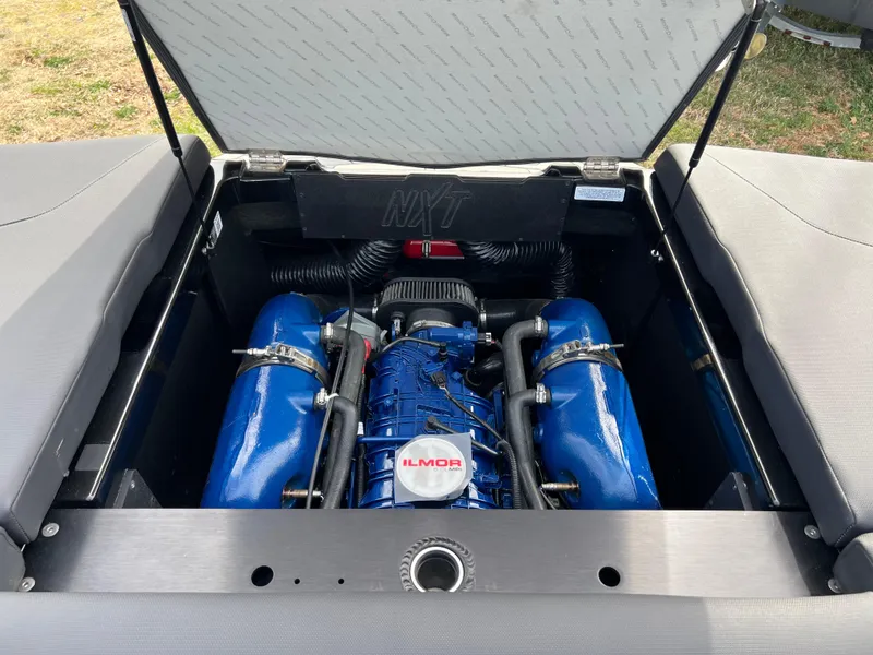 Slide: The Image of 2020 MasterCraft NXT22 engine compartment with Ilmor engine, open hatch view. - 17