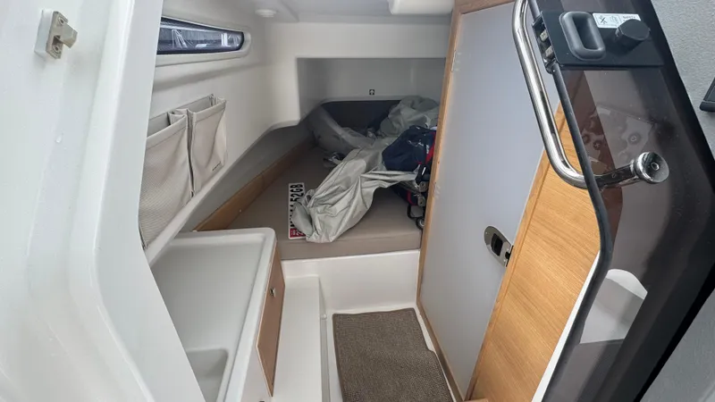 Slide: The Image of 2024 Nimbus T8 cabin interior with storage, bed, and modern design elements. - 28