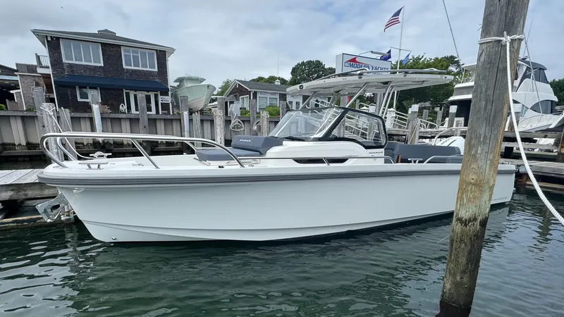 The Image of 2024 Nimbus T8 boat docked at a marina, featuring sleek design and modern amenities. - 0