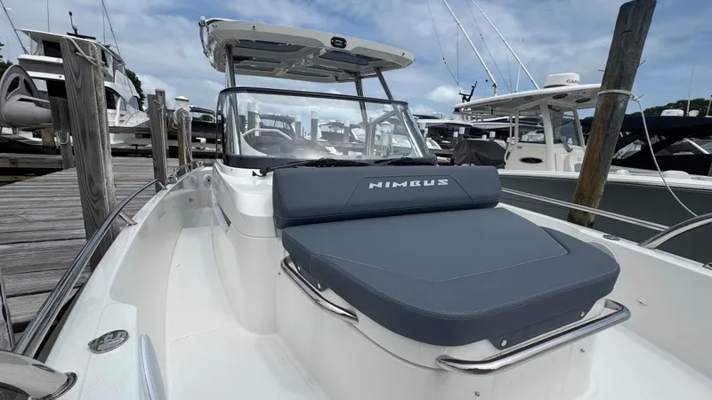Slide: The Image of 2024 Nimbus T8 boat docked, featuring sleek design and comfortable seating. - 22