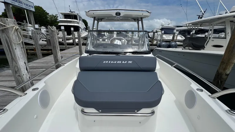 Slide: The Image of 2024 Nimbus T8 boat docked, featuring sleek design and comfortable seating. - 23