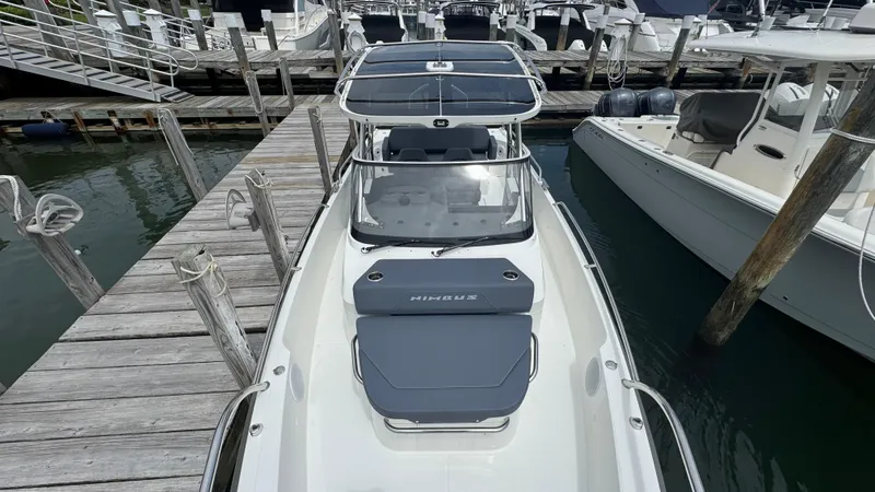Slide: The Image of 2024 Nimbus T8 boat docked at marina, showcasing sleek design and modern features. - 25