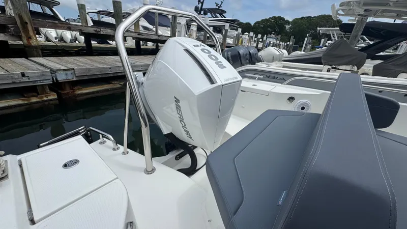 Slide: The Image of 2024 Nimbus T8 boat with Mercury outboard engine docked at marina. - 6