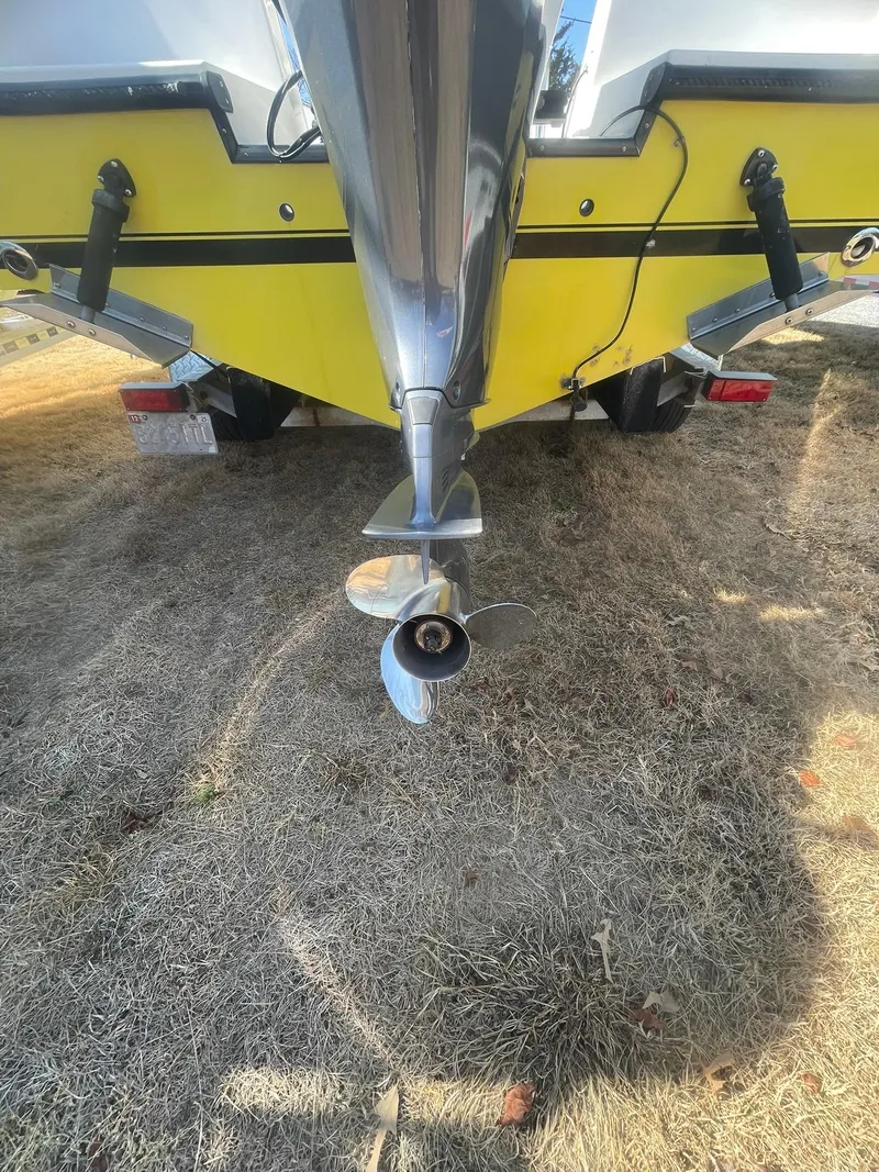 Slide: The Image of Contender 21 CC boat, 1998 model, repowered in 2018, rear view with propeller. - 10