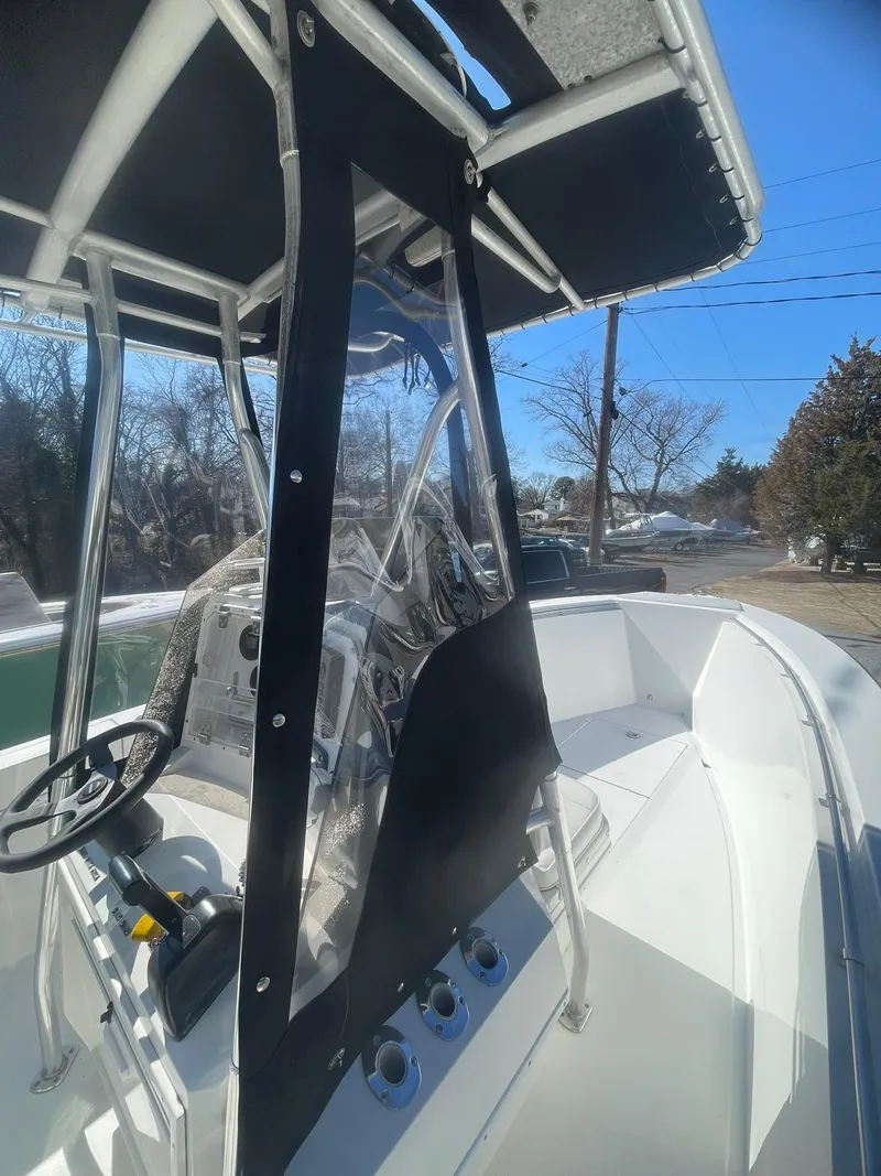 Slide: The Image of 1998 Contender 21 CC boat with T-top and console, repowered in 2018. - 18