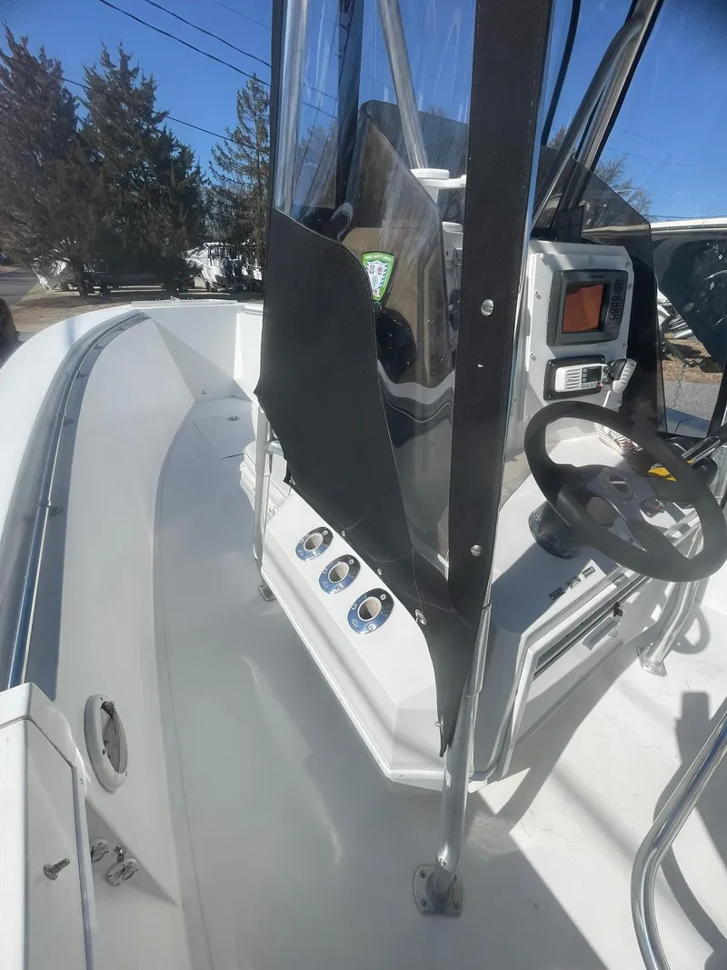 Slide: The Image of 1998 Contender 21 CC boat interior with steering console, repowered in 2018. - 20
