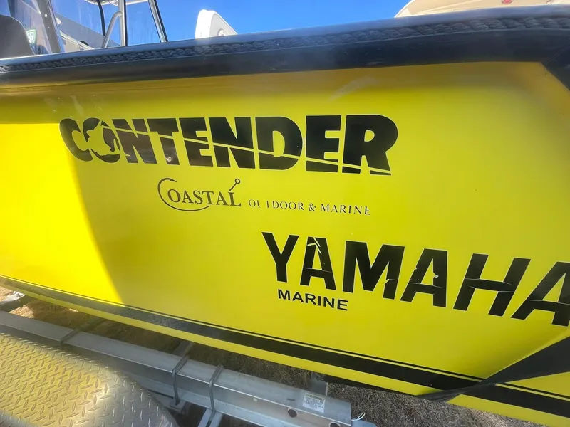 Slide: The Image of Yellow Contender 21 CC boat with Yamaha Marine branding, repowered in 2018. - 5