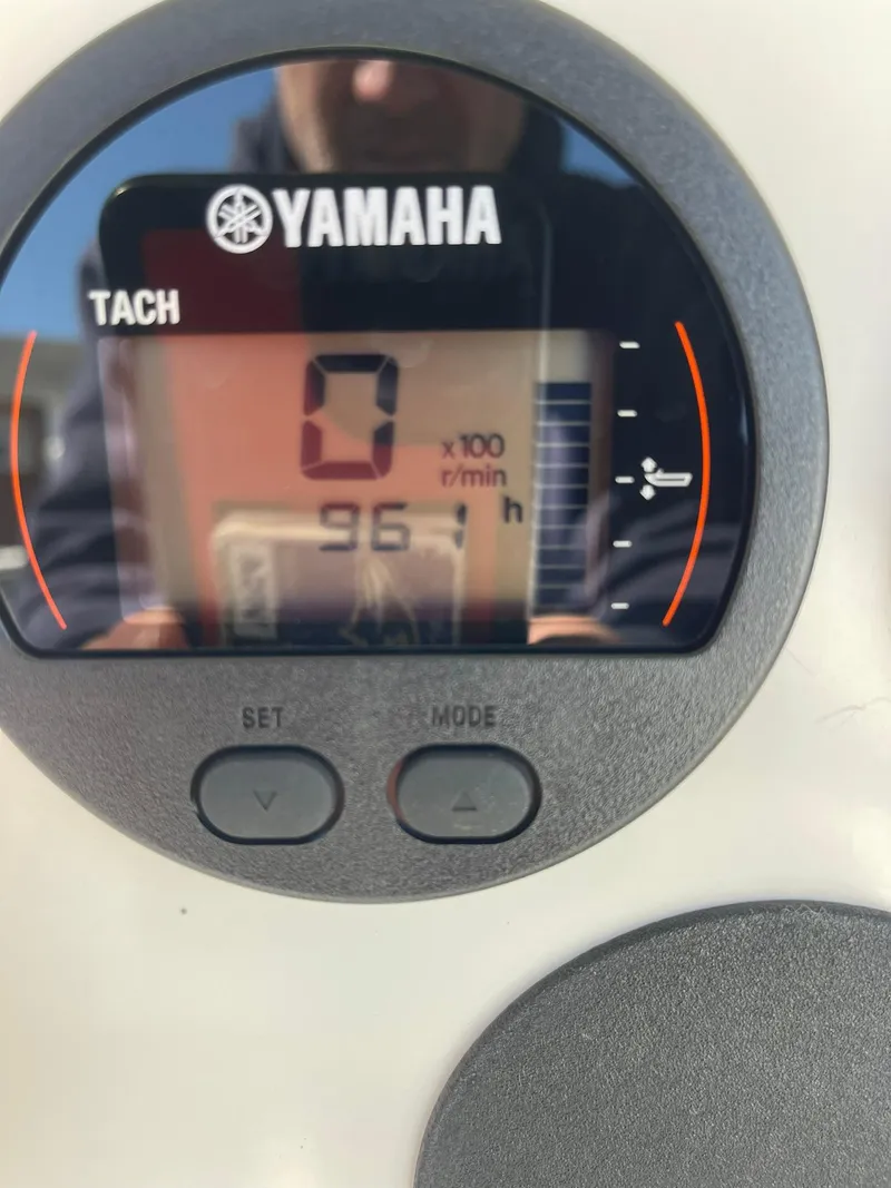 Slide: The Image of Yamaha tachometer displaying 96.1 hours on Contender 21 CC boat, repowered in 2018. - 7