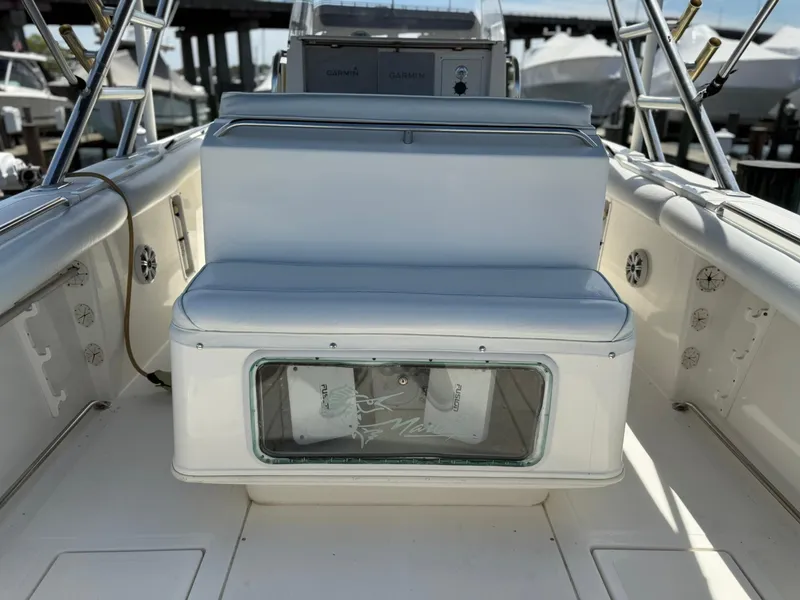 Slide: The Image of 2006 Marlago FS35 boat interior with white seating and storage compartment. - 19