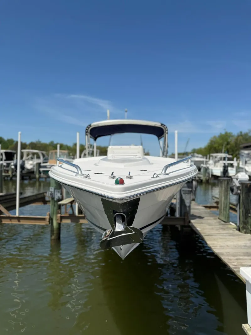 Slide: The Image of 2006 Marlago FS35 boat docked at marina under clear blue sky. - 25
