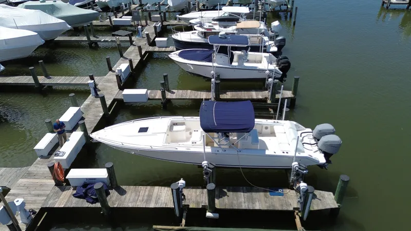Slide: The Image of 2006 Marlago FS35 boat docked at marina with other vessels. - 3