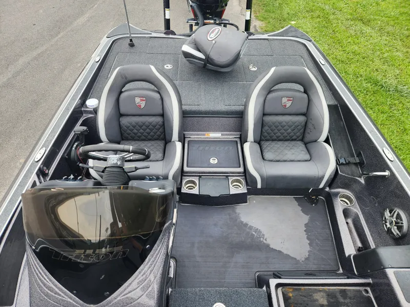 Slide: The Image of 2021 Triton 20 TRX boat interior with dual seats and steering console. - 12