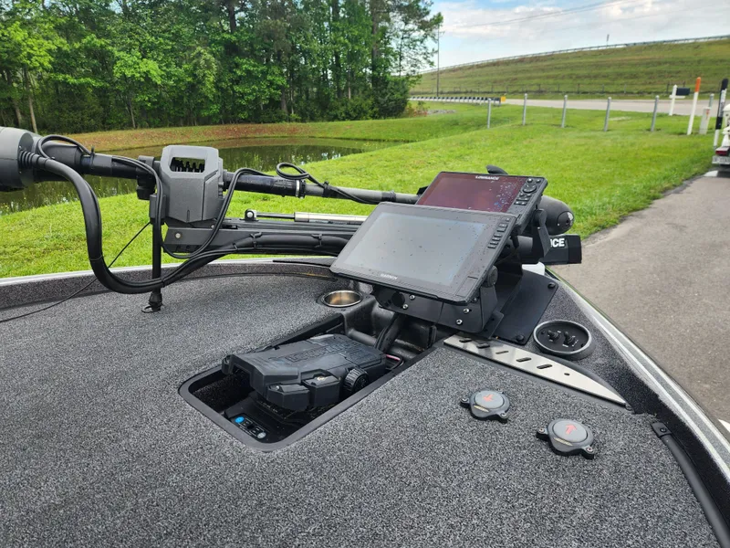 Slide: The Image of 2021 Triton 20 TRX boat dashboard with advanced navigation and control systems. - 9