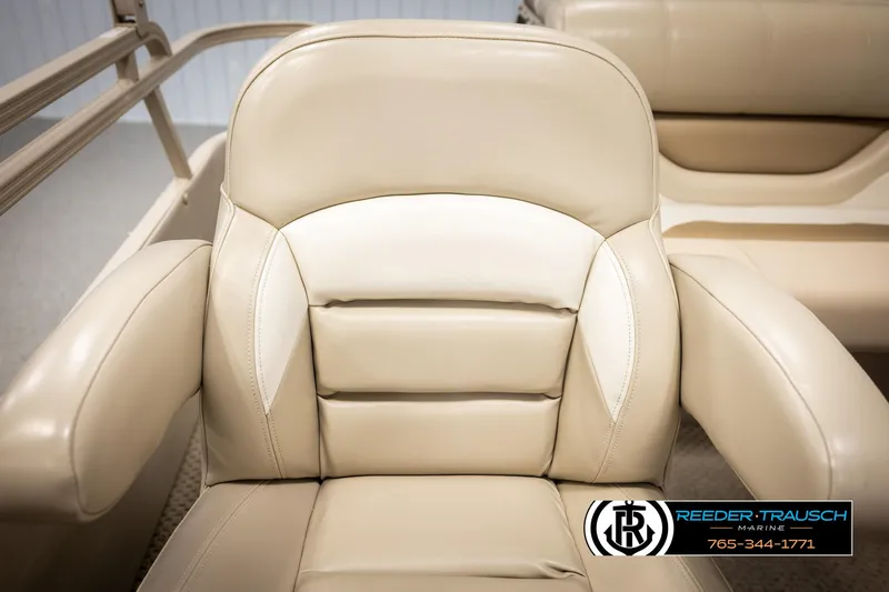 Slide: The Image of Beige leather seat on 2006 Sylvan 8524 Mirage RE boat, featuring armrests and cushioned backrest. - 23