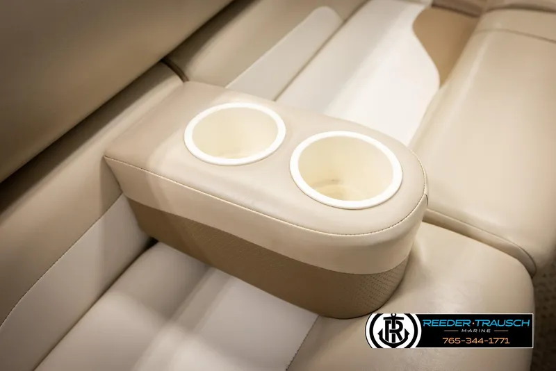 Slide: The Image of Cup holders on beige seating of 2006 Sylvan 8524 Mirage RE boat. - 26
