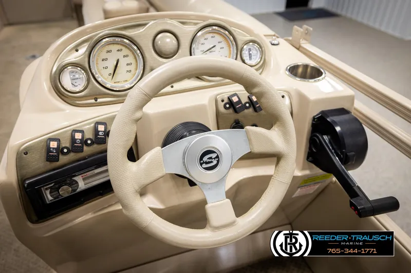 Slide: The Image of Steering console of 2006 Sylvan 8524 Mirage RE boat with gauges and controls. - 30