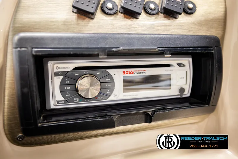 Slide: The Image of 2006 Sylvan 8524 Mirage RE dashboard with Boss Bluetooth stereo system. - 32