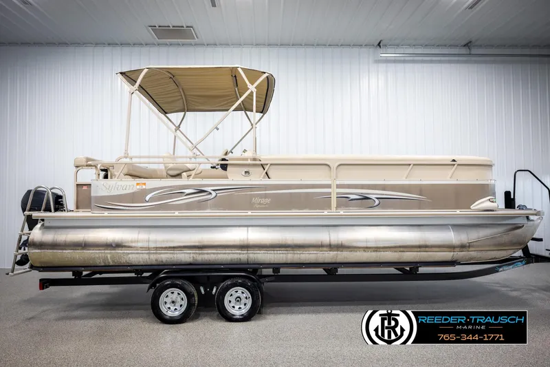 Slide: The Image of 2006 Sylvan 8524 Mirage RE pontoon boat on trailer in indoor showroom. - 5