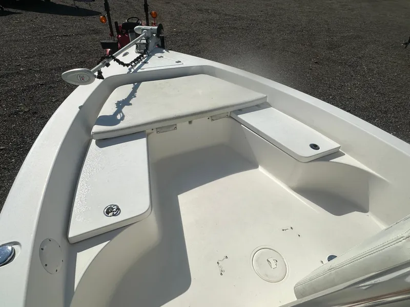 Slide: The Image of 2021 Cobia 21 Bay boat interior with seating and storage compartments. - 21