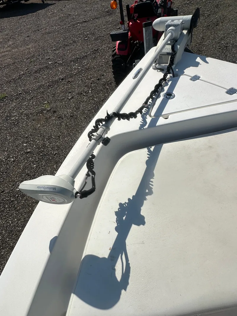 Slide: The Image of 2021 Cobia 21 Bay boat with mounted trolling motor on deck. - 27