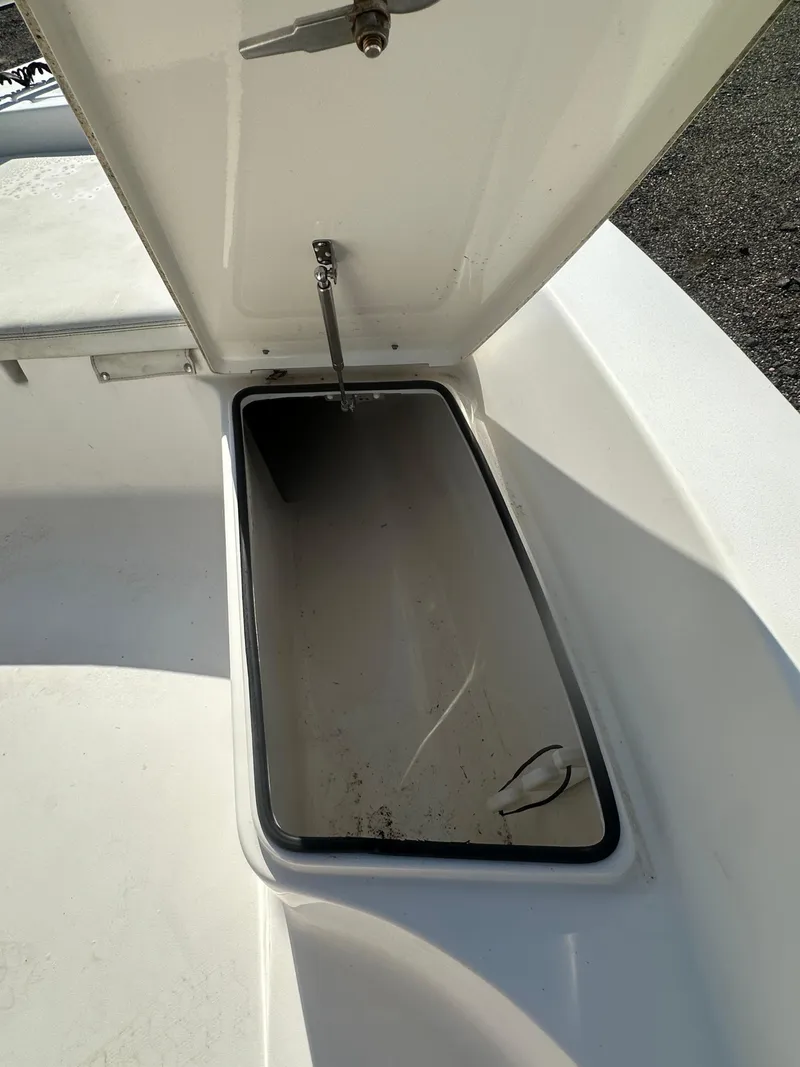 Slide: The Image of Open storage compartment on a 2021 Cobia 21 Bay boat. - 29