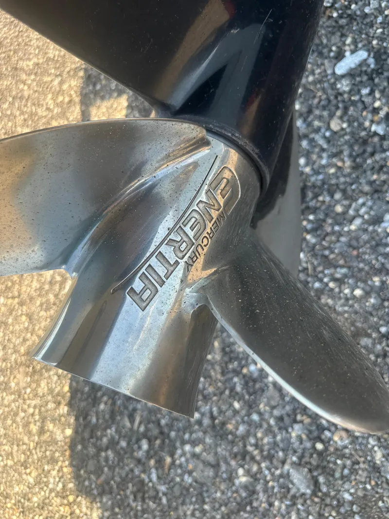 Slide: The Image of Close-up of a stainless steel boat propeller on a 2021 Cobia 21 Bay. - 32