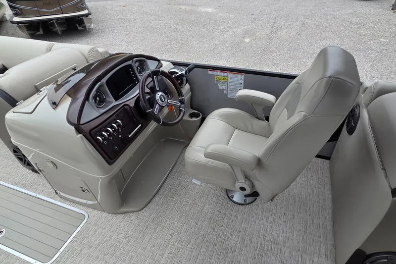 Slide: The Image of Captain's chair and helm of 2018 South Bay 725 RS ARCH DELUXE 3.0 pontoon boat. - 10