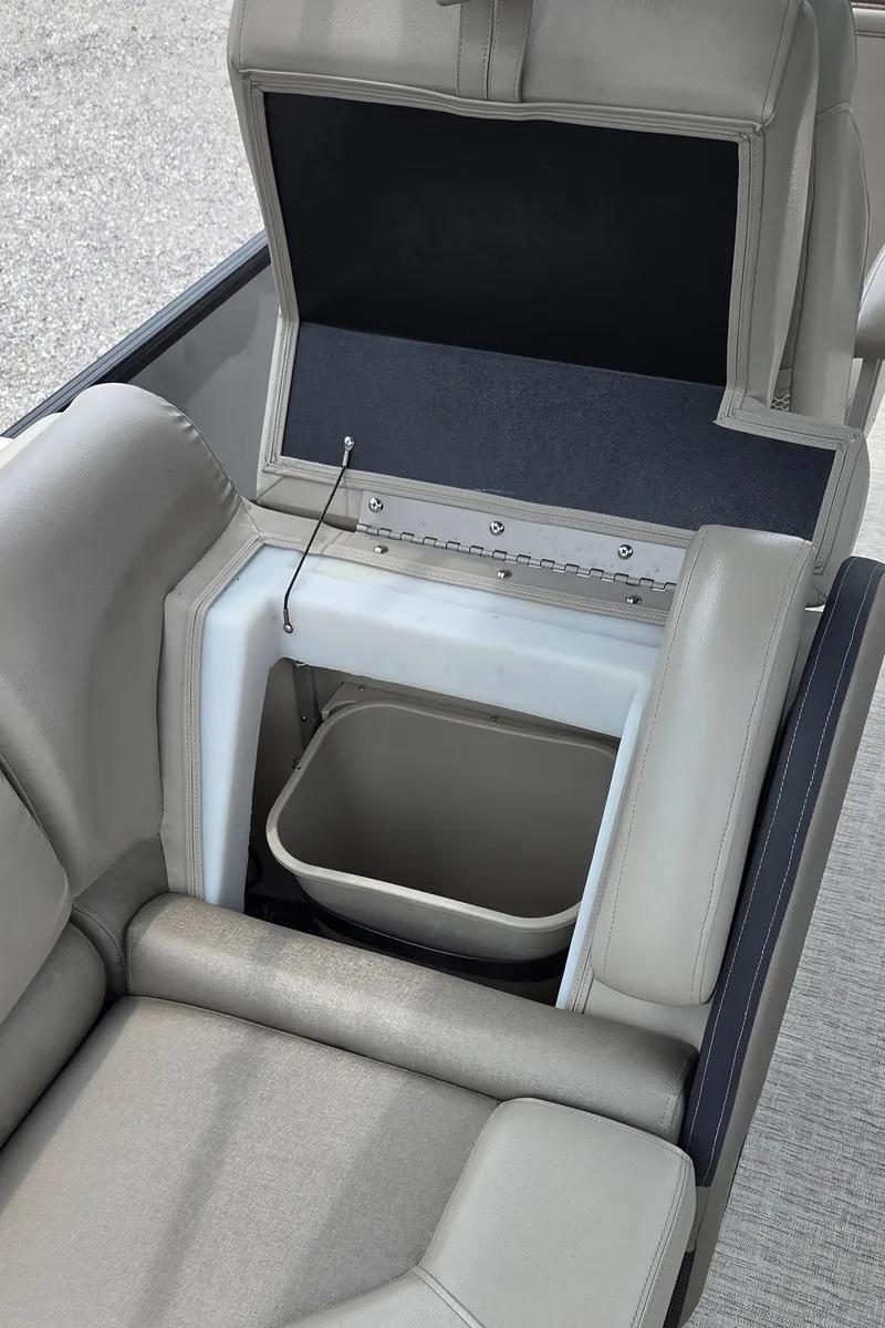 Slide: The Image of 2018 South Bay 725 RS ARCH DELUXE 3.0 boat seat with storage compartment open. - 14