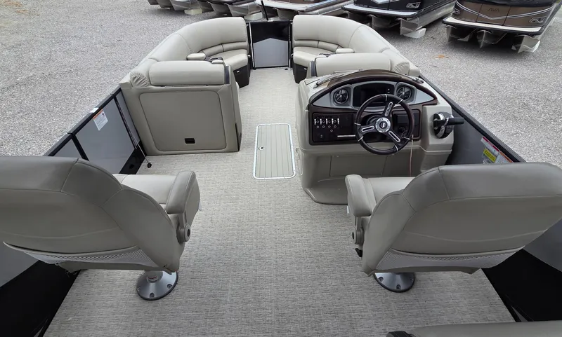 Slide: The Image of 2018 South Bay 725 RS ARCH DELUXE 3.0 pontoon boat interior with plush seating and steering console. - 9