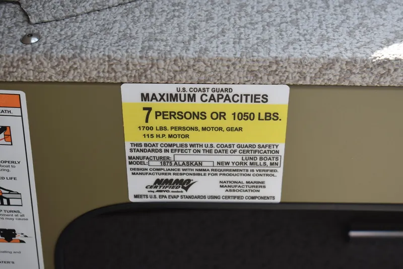 Slide: The Image of 2025 Lund 1875 Alaskan SS capacity label: 7 persons or 1050 lbs, 115 HP motor. - 11