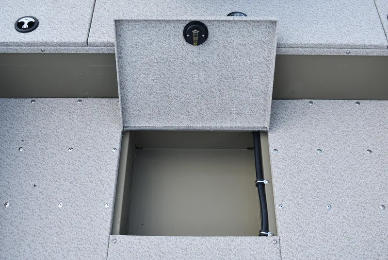 Slide: The Image of 2025 Lund 1875 Alaskan SS boat storage compartment with open hatch and visible interior. - 16