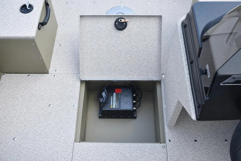 Slide: The Image of 2025 Lund 1875 Alaskan SS boat storage compartment with battery charger. - 17