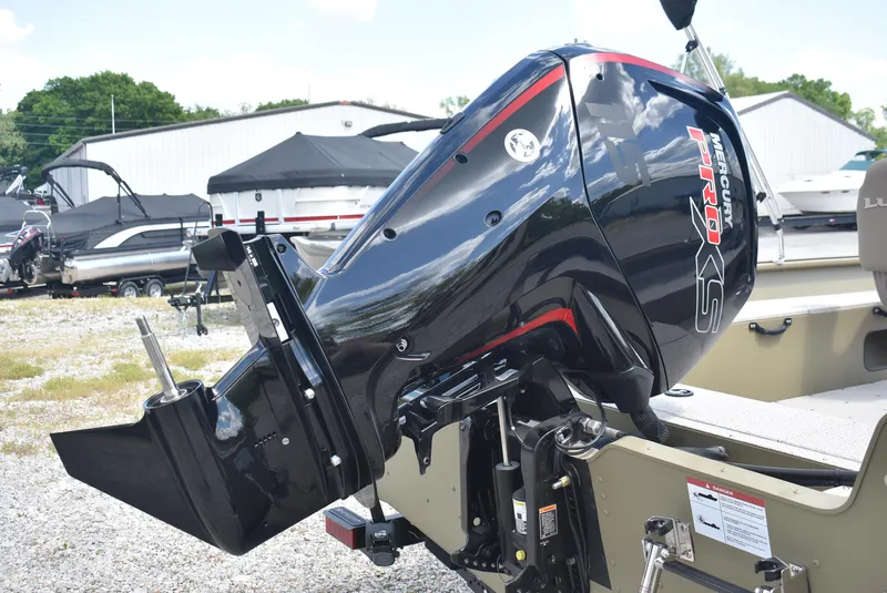 Slide: The Image of 2025 Lund 1875 Alaskan SS boat with powerful outboard motor in a marina setting. - 6