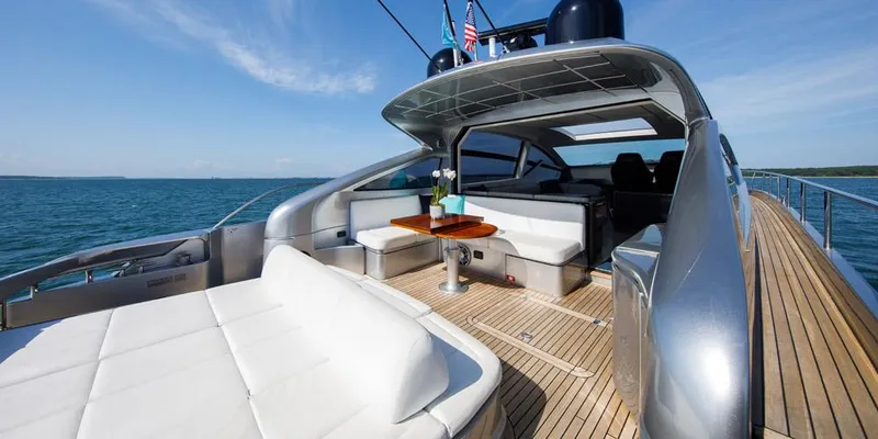 Slide: The Image of Luxurious 2015 Pershing 62' yacht with spacious deck and elegant seating on open water. - 3