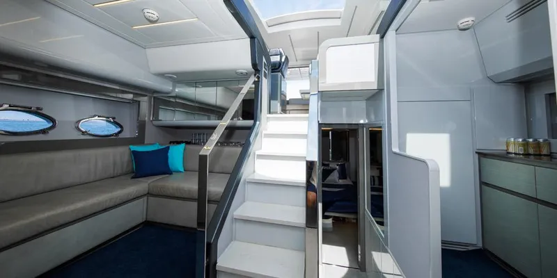 Slide: The Image of Luxurious interior of 2015 Pershing 62' yacht with modern seating and elegant staircase. - 6