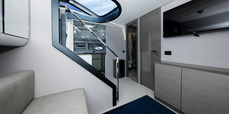 Slide: The Image of Interior of 2015 Pershing 62' yacht, featuring modern design and sleek furnishings. - 8