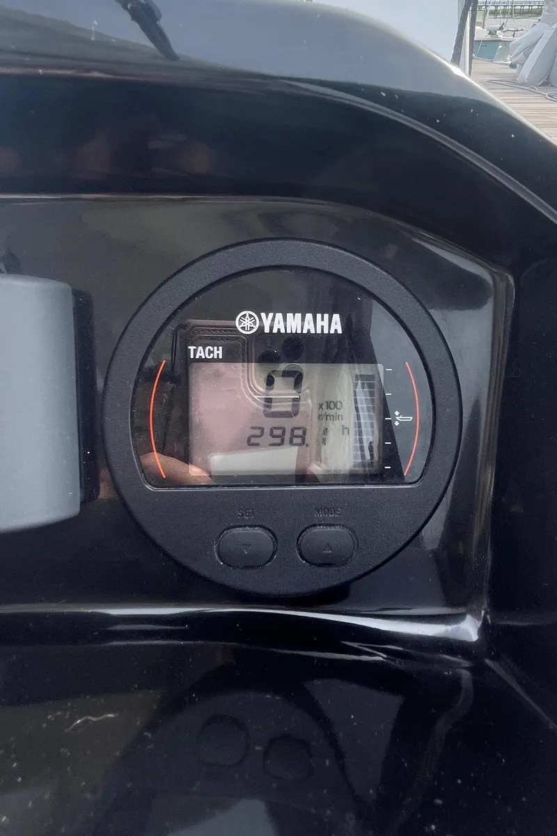 Slide: The Image of Yamaha tachometer on 2019 Jeanneau NC 695 boat dashboard displaying 298 hours. - 11