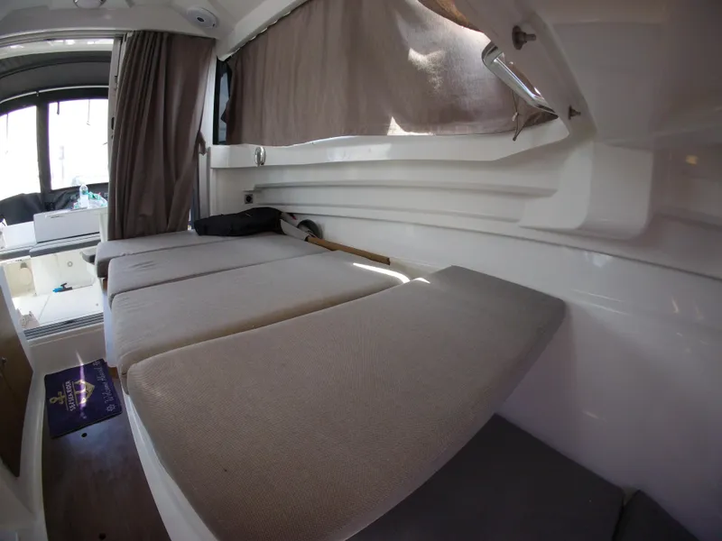 Slide: The Image of Interior cabin of 2019 Jeanneau NC 695 boat with cushioned seating. - 26