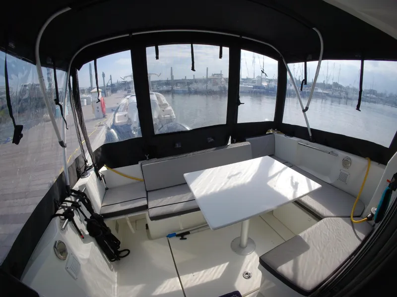 Slide: The Image of Interior view of 2019 Jeanneau NC 695 boat with seating and table. - 29