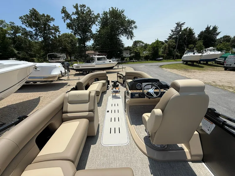 Slide: The Image of 2025 Premier 230 Sunsation Angler 2pt pontoon boat with spacious seating and modern helm. - 16