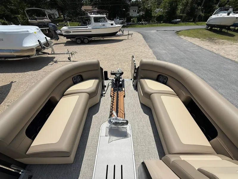 Slide: The Image of 2025 Premier 230 Sunsation Angler 2pt boat interior with beige seating and modern design. - 17