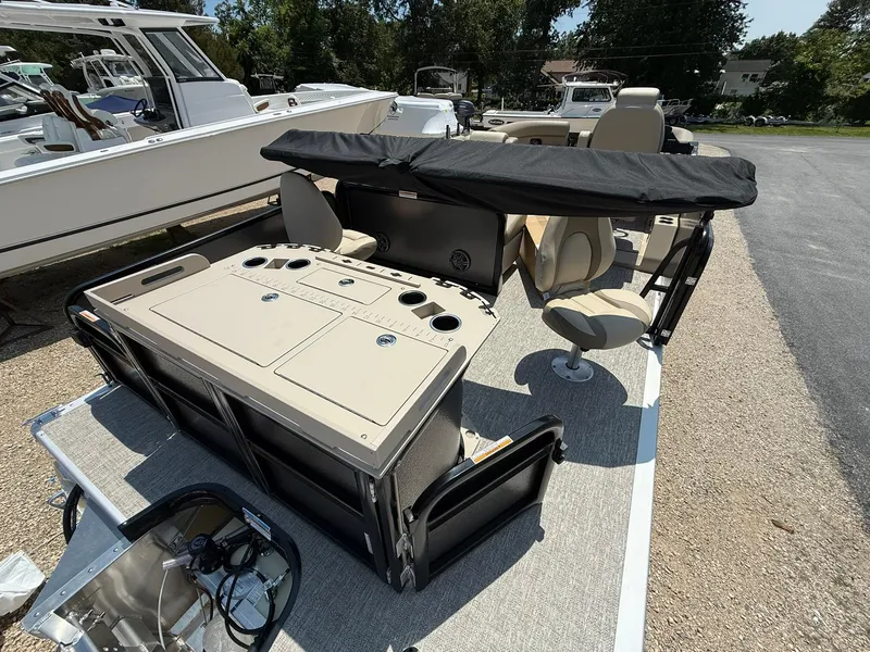 Slide: The Image of 2025 Premier 230 Sunsation Angler 2pt boat with seating and fishing amenities. - 5