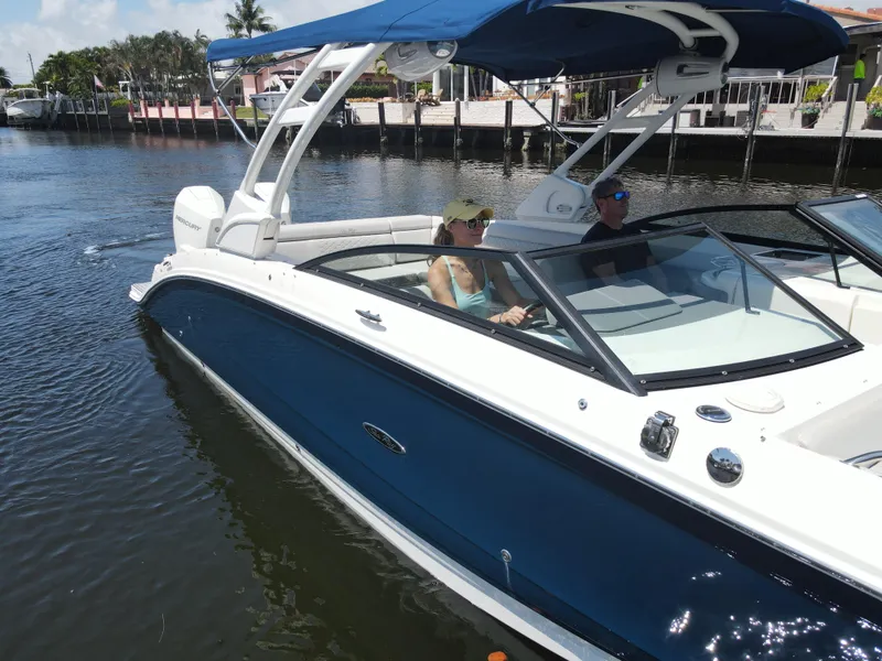 Slide: The Image of 2021 Sea Ray SDX 290 Outboard cruising on a sunny day with passengers onboard. - 10