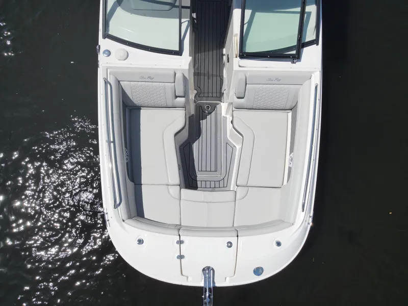 Slide: The Image of 2021 Sea Ray SDX 290 Outboard boat, aerial view, spacious seating, sleek design. - 11