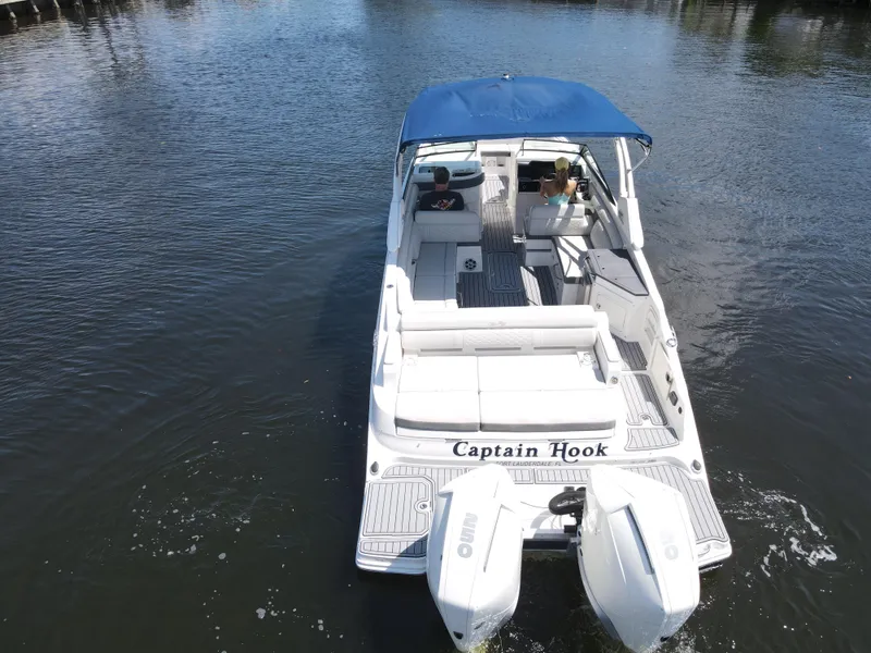 Slide: The Image of 2021 Sea Ray SDX 290 Outboard boat with blue canopy cruising on water. - 15