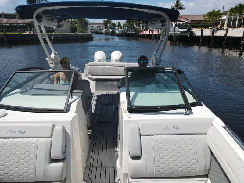 Slide: The Image of 2021 Sea Ray SDX 290 Outboard cruising on a sunny canal. - 17